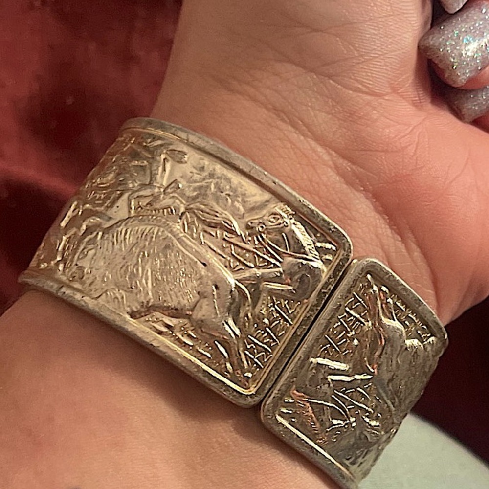 Silver buffalo bangle hinge bracelet.